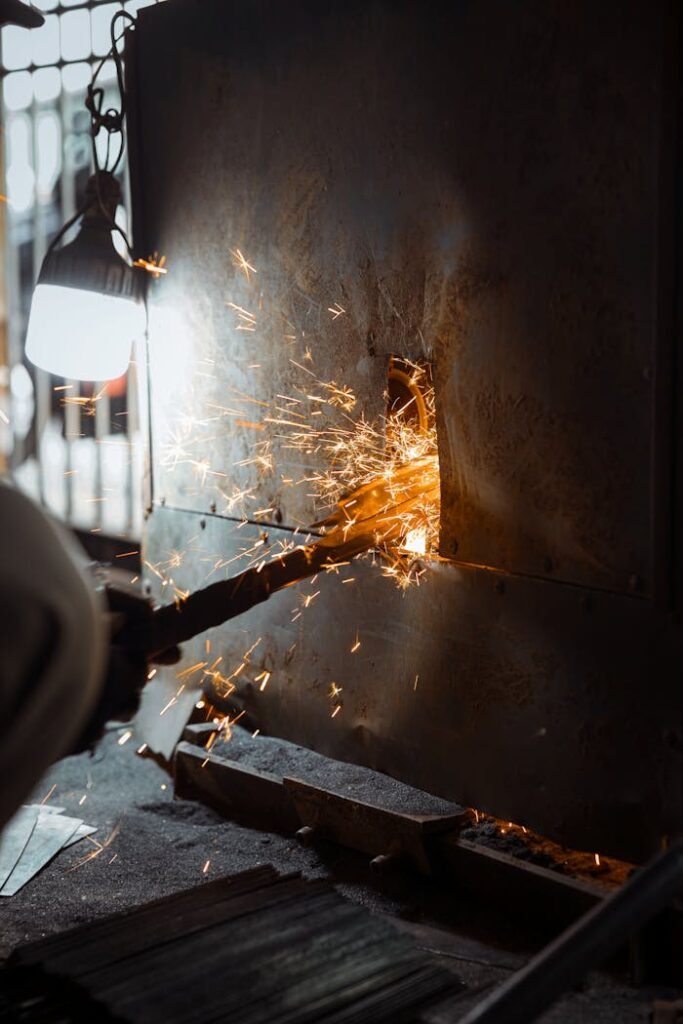 Close-up of Sparks Flying from Metal Grinding Process 